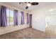 Bedroom with carpet, ample natural light from two windows and a ceiling fan at 5568 Table Top Ln, Las Vegas, NV 89135