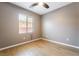 Comfortable bedroom featuring a ceiling fan and a window with natural light at 5568 Table Top Ln, Las Vegas, NV 89135