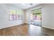 Well-lit bedroom with wood floors and a sliding glass door leading to the backyard at 5568 Table Top Ln, Las Vegas, NV 89135