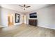 This primary bedroom features a ceiling fan, ensuite, and spacious closet at 5568 Table Top Ln, Las Vegas, NV 89135