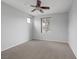 Serene bedroom with cozy carpet and a ceiling fan at 5625 Galivan Vista St, North Las Vegas, NV 89081