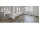 Spacious living room with neutral colors, tile flooring, and ample natural light at 5625 Galivan Vista St, North Las Vegas, NV 89081