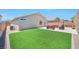 Grassy backyard with patio area provides great outdoor space for activities and relaxation at 5732 Hornbrook St, North Las Vegas, NV 89031