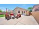A spacious backyard with patio furniture and a concrete patio at 5732 Hornbrook St, North Las Vegas, NV 89031