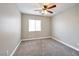 Neutral bedroom features carpet, ceiling fan, and a sunny window at 5732 Hornbrook St, North Las Vegas, NV 89031