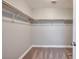Walk-in closet with carpeting and closet rod for ample storage at 5732 Hornbrook St, North Las Vegas, NV 89031