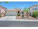 Inviting single-story home featuring a two-car garage, neutral paint scheme and desert landscaping at 5732 Hornbrook St, North Las Vegas, NV 89031