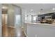 Modern kitchen with stainless steel appliances and a breakfast bar overlooking the spacious living area at 5732 Hornbrook St, North Las Vegas, NV 89031