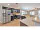 Well-appointed kitchen with stainless steel appliances, dark cabinetry, and tile backsplash at 5732 Hornbrook St, North Las Vegas, NV 89031