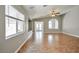 Bright, open living room features tile flooring and a ceiling fan at 5732 Hornbrook St, North Las Vegas, NV 89031