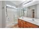 Spacious bathroom featuring double sinks, and a large glass shower at 5732 Hornbrook St, North Las Vegas, NV 89031