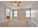 Spacious main bedroom with plush carpet, with ensuite bathroom view at 5732 Hornbrook St, North Las Vegas, NV 89031
