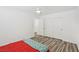 Bright bedroom with wood-look floors and a ceiling fan, offering ample closet space at 6313 Pangea Ave, Las Vegas, NV 89139
