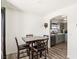 Dining area with a table, chairs, and view into the kitchen at 6313 Pangea Ave, Las Vegas, NV 89139