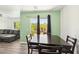 Open concept dining area with a table, chairs, and access to a balcony at 6313 Pangea Ave, Las Vegas, NV 89139