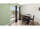 Dining area with table, chairs, and a sliding door to a balcony at 6313 Pangea Ave, Las Vegas, NV 89139