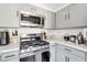 Contemporary kitchen with stainless steel appliances and ample counter space at 6313 Pangea Ave, Las Vegas, NV 89139