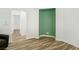 Bright living room with wood-look floors, recessed lighting, and accent wall at 6313 Pangea Ave, Las Vegas, NV 89139