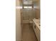 A bathroom featuring a shower and tub, white cabinets and marbled countertops at 6615 Elk Creek Ln, Las Vegas, NV 89156
