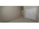 A spacious, carpeted bedroom with a closet, offering ample storage and a clean, modern look at 6615 Elk Creek Ln, Las Vegas, NV 89156