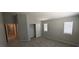A carpeted bedroom showcasing a closet and a window, providing a comfortable and well-lit space at 6615 Elk Creek Ln, Las Vegas, NV 89156