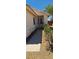 The exterior front entrance shows a paved walkway leading to the front door at 6615 Elk Creek Ln, Las Vegas, NV 89156