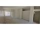 Bright and airy living room with a neutral color scheme and large windows at 6615 Elk Creek Ln, Las Vegas, NV 89156