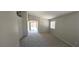 The spacious living room features neutral paint, new carpeting and natural light at 6615 Elk Creek Ln, Las Vegas, NV 89156
