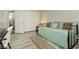 Cozy bedroom featuring a daybed with a decorative rug, storage, and a sliding-door closet at 6617 Golden Bit Ave, Las Vegas, NV 89131