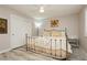 Well-lit bedroom with a metal-frame bed, soft bedding, and a spacious closet at 6617 Golden Bit Ave, Las Vegas, NV 89131