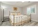Serene bedroom with a metal-frame bed, soft bedding, and a bright, shuttered window at 6617 Golden Bit Ave, Las Vegas, NV 89131