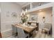 Well-lit dining room featuring modern lighting, neutral colors, and stylish decor at 6617 Golden Bit Ave, Las Vegas, NV 89131