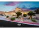 Charming single-Gathering home featuring desert landscaping, a tile roof, and a three-car garage at 6617 Golden Bit Ave, Las Vegas, NV 89131