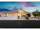 Charming single-Gathering home features a three-car garage, desert landscaping, and a tile roof at 6617 Golden Bit Ave, Las Vegas, NV 89131
