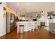 Open kitchen area with a large island, seating, and stainless steel appliances, ideal for social gatherings at 6617 Golden Bit Ave, Las Vegas, NV 89131