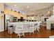 Bright kitchen with a central island, seating, and modern lighting, perfect for casual dining and entertaining at 6617 Golden Bit Ave, Las Vegas, NV 89131