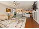 Open living room and kitchen area with hardwood floors and modern ceiling fan at 6617 Golden Bit Ave, Las Vegas, NV 89131