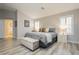 Bright main bedroom with hardwood floors, large windows, and a plush bed at 6617 Golden Bit Ave, Las Vegas, NV 89131