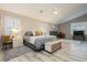 Spacious main bedroom features light, airy space with hardwood floors and large windows at 6617 Golden Bit Ave, Las Vegas, NV 89131