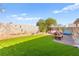 Enjoy the well-maintained backyard with artificial grass, providing a low-maintenance outdoor space at 7032 Wonderberry St, Las Vegas, NV 89131