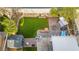 Aerial view of backyard boasting a patio, artificial grass, landscaping, and storage shed at 7032 Wonderberry St, Las Vegas, NV 89131