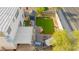 Aerial view of backyard boasting a patio area, artificial grass, landscaping, and storage shed at 7032 Wonderberry St, Las Vegas, NV 89131