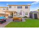 Landscaped backyard with a covered patio, artificial grass and a storage shed offering space for outdoor living at 7032 Wonderberry St, Las Vegas, NV 89131