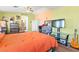 Spacious bedroom with natural light, a ceiling fan, hardwood flooring, and closet at 7032 Wonderberry St, Las Vegas, NV 89131
