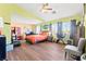 Spacious bedroom with natural light, a ceiling fan, and hardwood flooring at 7032 Wonderberry St, Las Vegas, NV 89131