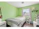 Bright bedroom with a comfortable queen bed, sunny window, and ample space for relaxation at 7032 Wonderberry St, Las Vegas, NV 89131