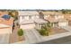 Charming two-story home with a well-kept lawn and inviting front entrance, showcasing a cozy Gathering residence at 7032 Wonderberry St, Las Vegas, NV 89131