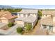 Well-maintained two-story home with a tidy front yard, showing great curb appeal in a residential neighborhood at 7032 Wonderberry St, Las Vegas, NV 89131