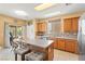 Charming kitchen featuring a large island, ample cabinet space, and stainless steel appliances at 7032 Wonderberry St, Las Vegas, NV 89131