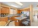 Traditional kitchen with stainless steel appliances, tile backsplash and a center island at 7032 Wonderberry St, Las Vegas, NV 89131